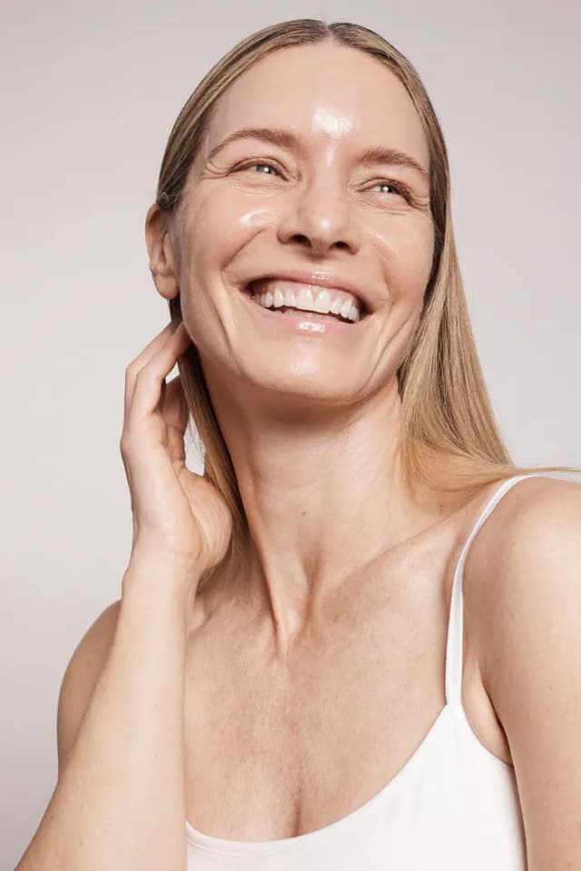 Woman with smooth radiant skin after Hydrafacial treatment.