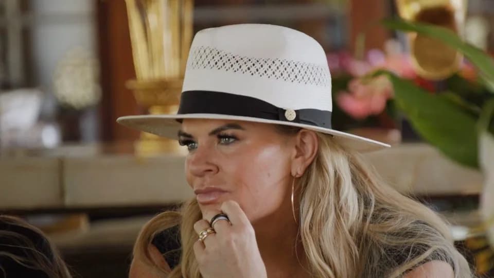 Heather Gay wearing a white hat during The Real Housewives Ultimate Girls Trip.