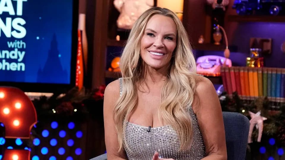 Heather Gay smiling in a silver dress on Watch What Happens Live.